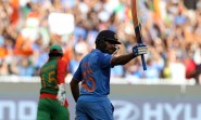 Indian cricketer Rohit Sharma during the ICC World Cup - 2015 quarter final match between India and Bangladesh at Melbourne Cricket Ground in Australia on March 19, 2015. (Photo: IANS)