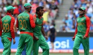 Bangladeshi players celebrate fall of a wicket during the ICC World Cup - 2015 quarter final match between India and Bangladesh at Melbourne Cricket Ground in Australia on March 19, 2015. (Photo: IANS)