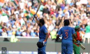 Indian cricketers Rohit Sharma and Suresh Raina during the ICC World Cup - 2015 quarter final match between India and Bangladesh at Melbourne Cricket Ground in Australia on March 19, 2015. (Photo: IANS)