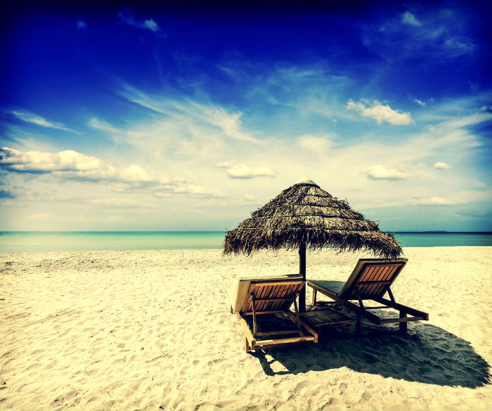 Lounge chairs on the beach in Sihanoukville (Image © iStock.com/f9photos)