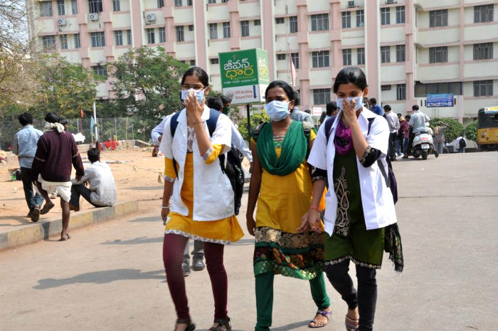 Gandhi Hospital staff wear masks to avoid contracting swine flu in Hyderabad, on Jan 20, 2015. (Image source: IANS)