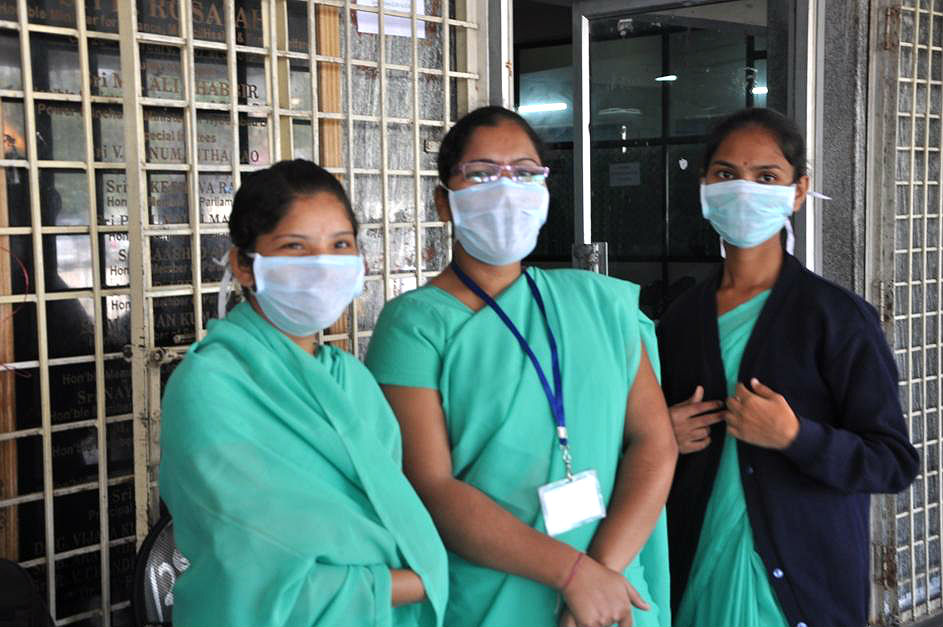 Gandhi Hospital staff wear masks to avoid contracting swine flu in Hyderabad, on Jan 20, 2015. (Image source: IANS)