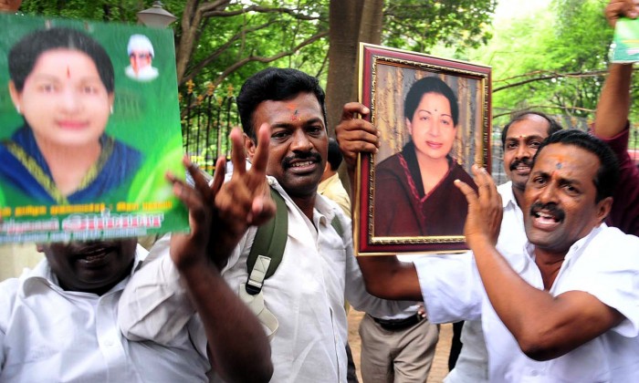 AIADMK supporters celebrate near former Tamil Nadu chief minister J. Jayalalithaa's outside the Karnataka High Court after the court acquitted her in the Rs.66.65-crore disproportionate assets' case, in Bengaluru on May 11, 2015. (Photo: IANS)