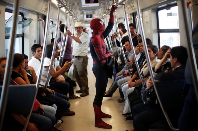 Moises Vazquez, 26, known as Spider-Moy, a computer science teaching assistant at the Faculty of Science of the National Autonomous University of Mexico (UNAM), who teaches dressed as a comic superhero Spider-Man, travels on a subway on his way to work in Mexico City, Mexico, May 27, 2016. REUTERS/Edgard Garrido      SEARCH "SPIDERMAN TEACHER" FOR THIS STORY. SEARCH "THE WIDER IMAGE" FOR ALL STORIES     TPX IMAGES OF THE DAY