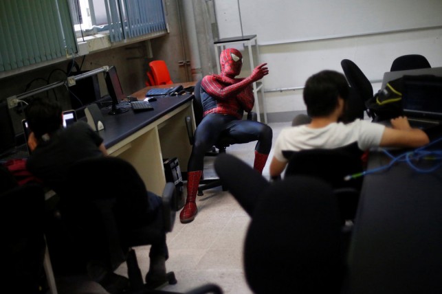 Moises Vazquez, 26, known as Spider-Moy, a computer science teaching assistant at the Faculty of Science of the National Autonomous University of Mexico (UNAM), teaches dressed as a comic superhero Spider-Man at the university in Mexico City, Mexico, May 27, 2016. REUTERS/Edgard Garrido      